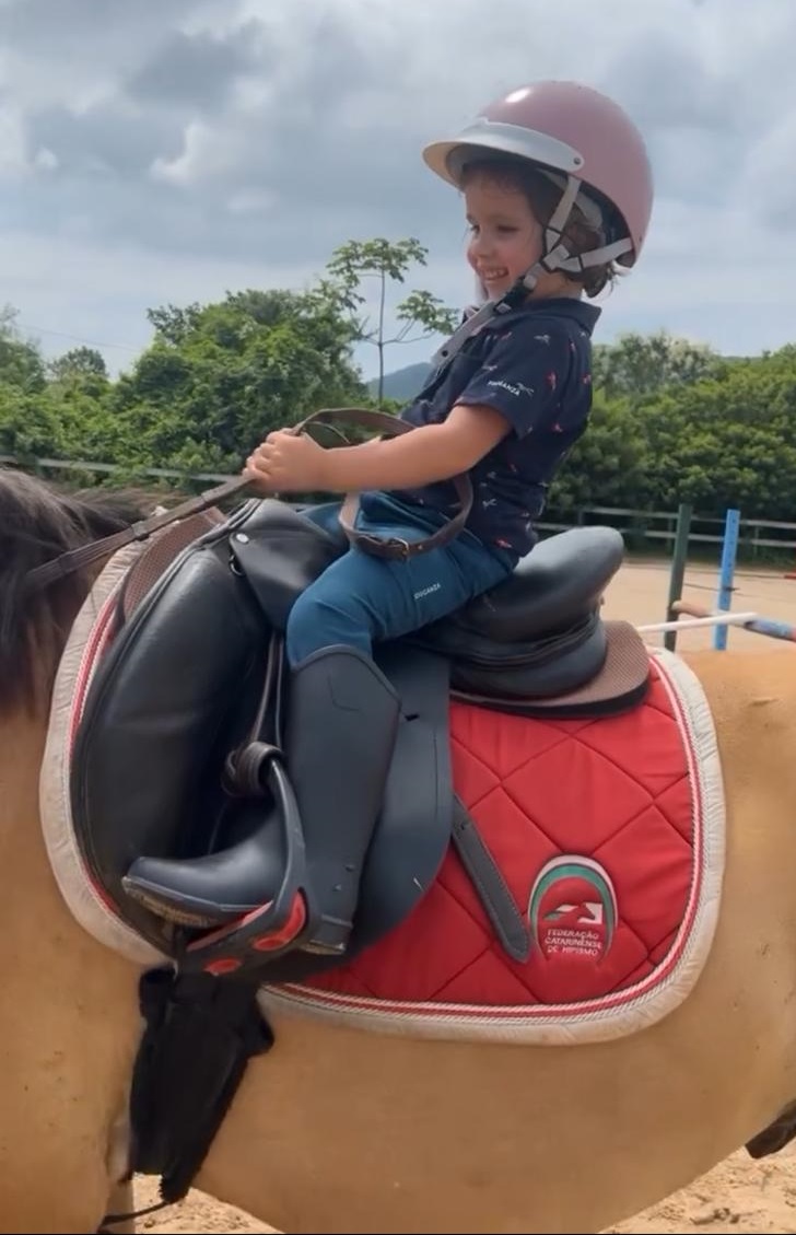 Trinity riding a horse
